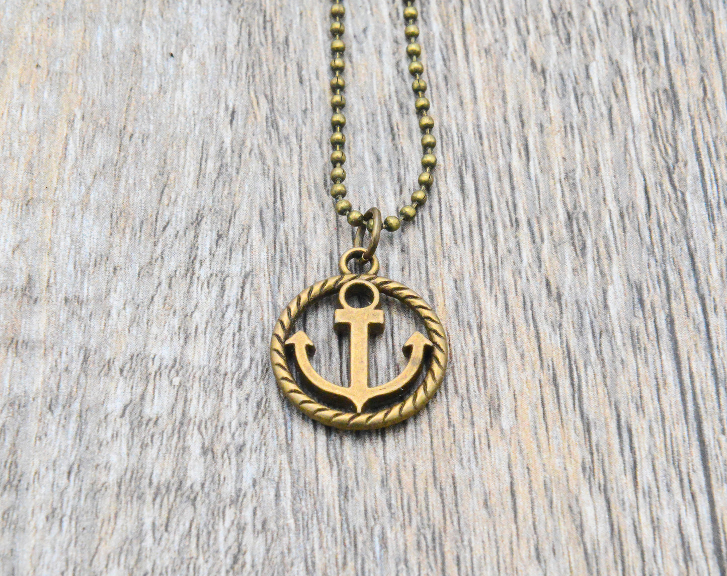 Maritime Kette mit Anker im Kreis Tau in bronze